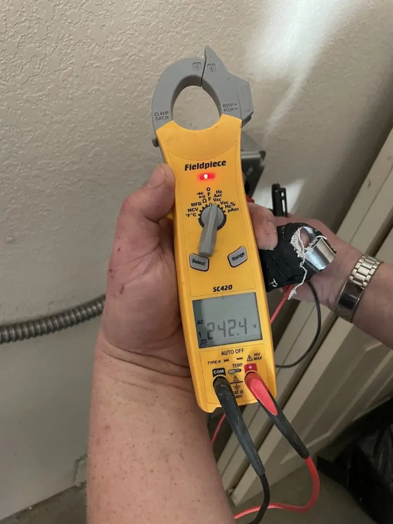 Voltage testing with clamp meter during Electrical Installation Services in Lansdowne